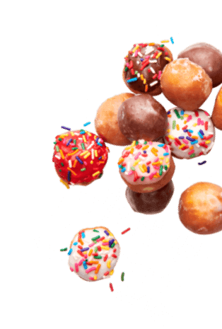 freshly baked donuts with sprinkles on top, perfect for indulging in a coffee shop franchise or exploring a franchise opportunity within the QSR industry.