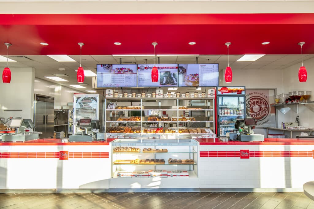 Interior of a brightly lit Shipley donut shop